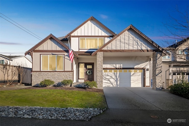 view of front of home featuring a garage and a front lawn