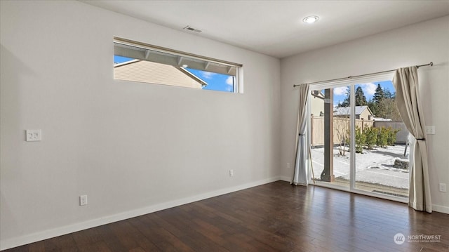 unfurnished room featuring dark hardwood / wood-style flooring