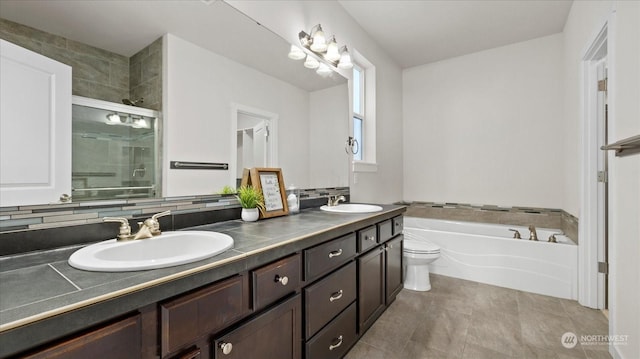 full bathroom with vanity, tile patterned floors, toilet, and separate shower and tub