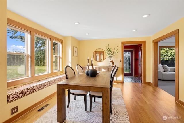 dining space featuring light wood-type flooring