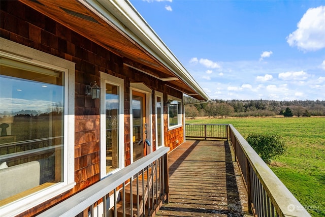 wooden terrace featuring a rural view