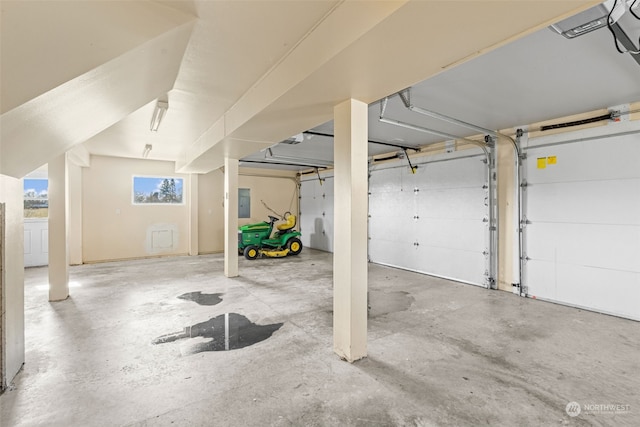 garage featuring a garage door opener and electric panel