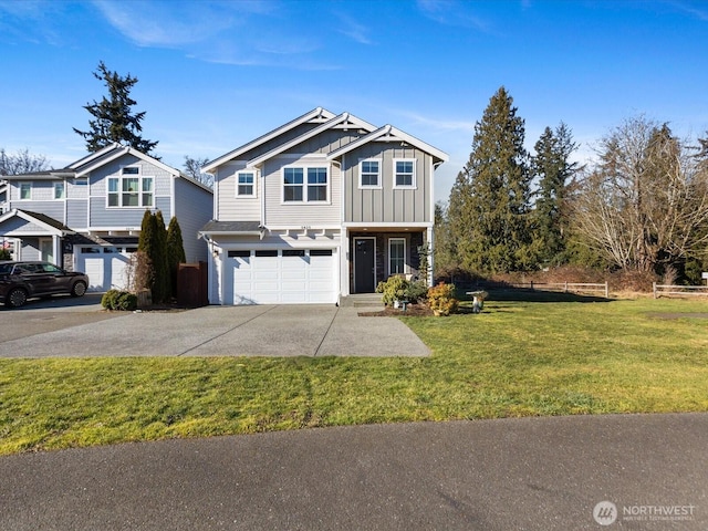 view of front of property featuring a garage and a front lawn