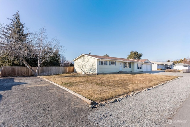 ranch-style home with a front yard