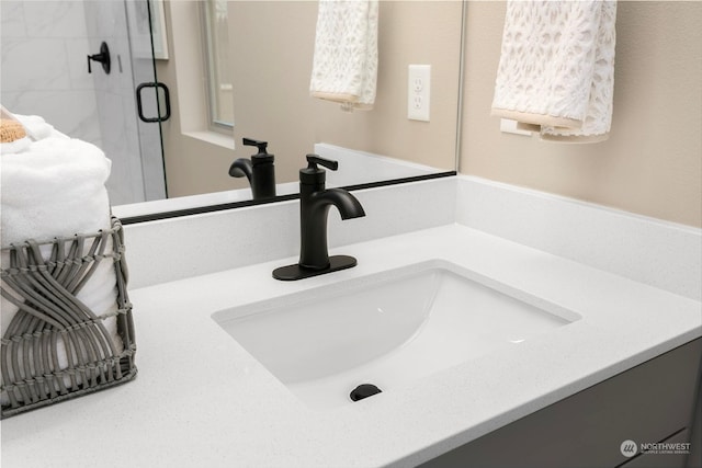 bathroom with vanity and an enclosed shower