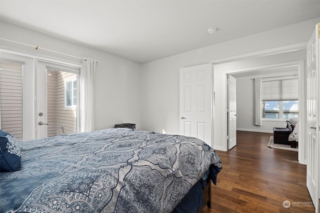 bedroom with dark hardwood / wood-style flooring