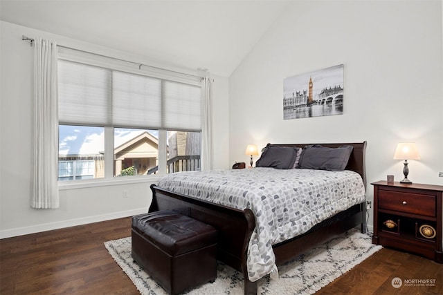 bedroom featuring dark hardwood / wood-style flooring and vaulted ceiling