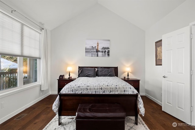 bedroom featuring lofted ceiling and dark hardwood / wood-style flooring