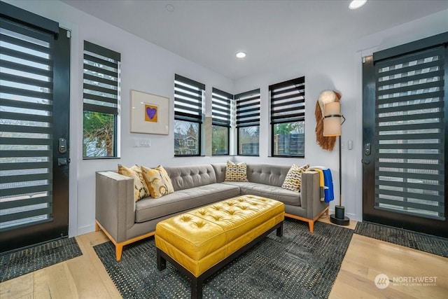 living area with hardwood / wood-style floors