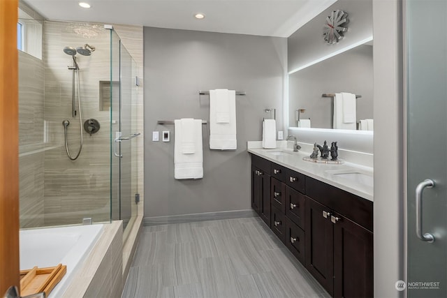 bathroom featuring vanity and plus walk in shower