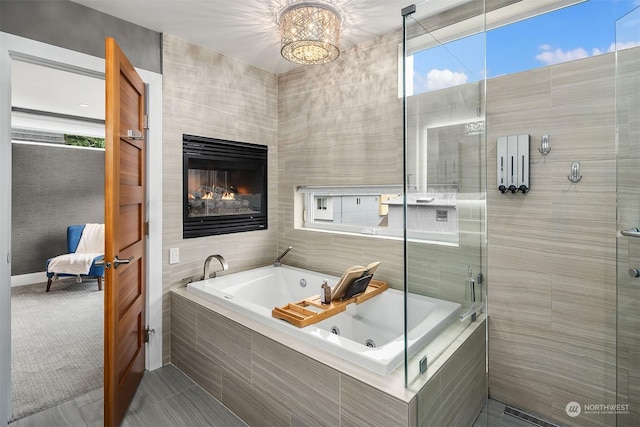 bathroom with plus walk in shower and a tiled fireplace