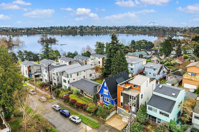 birds eye view of property featuring a water view