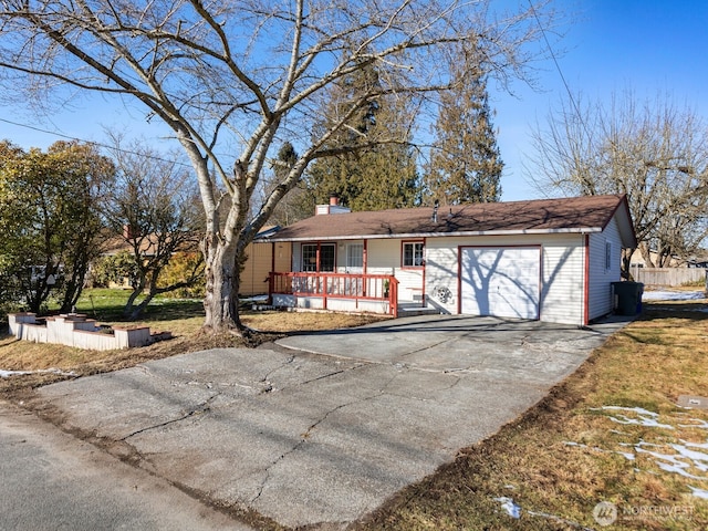 single story home with a garage and a porch