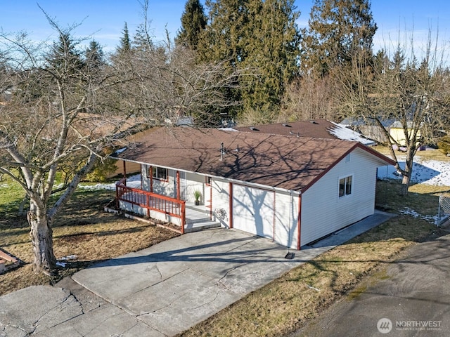 view of front of property with a garage and a porch