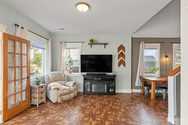 sitting room with dark parquet flooring