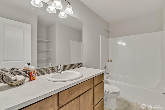 full bathroom featuring bathtub / shower combination, toilet, visible vents, vanity, and tile patterned floors