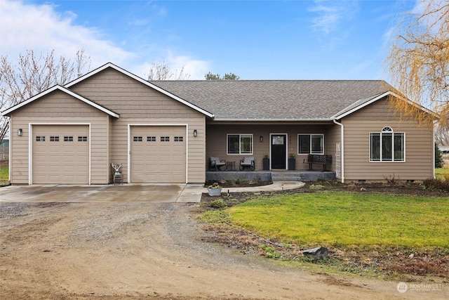 single story home featuring a porch, a garage, and a front yard