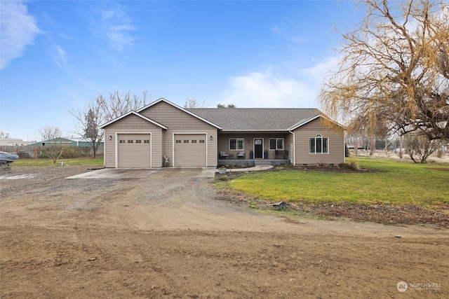 view of front of house with a garage and a front lawn