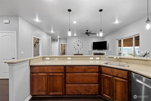 kitchen with sink, decorative light fixtures, stainless steel dishwasher, dark hardwood / wood-style floors, and ceiling fan