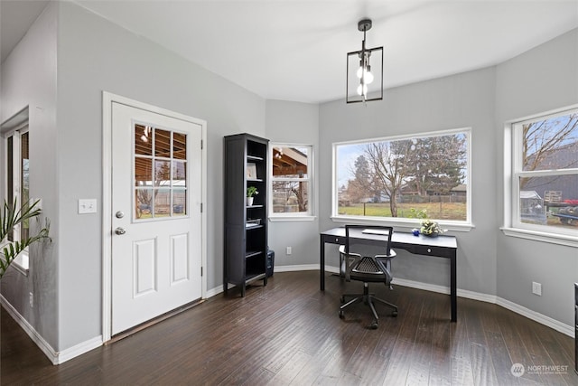 office featuring plenty of natural light and dark hardwood / wood-style flooring