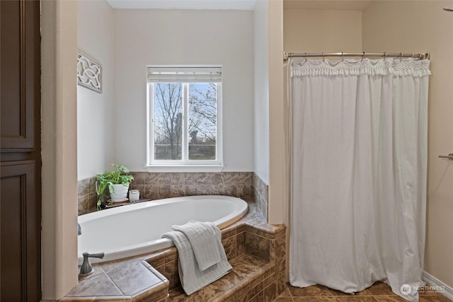 bathroom with tiled bath