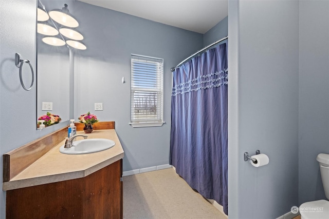 bathroom featuring vanity and toilet