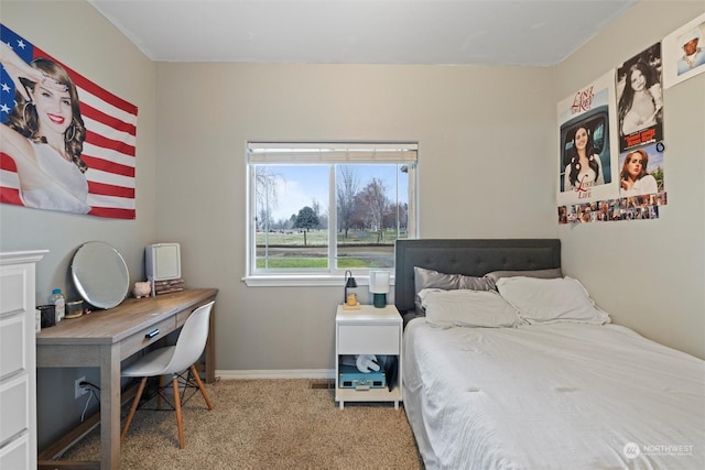 bedroom featuring light carpet