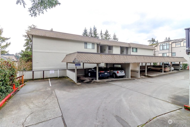 view of vehicle parking with a carport