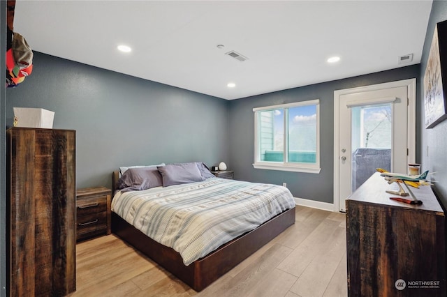 bedroom featuring access to exterior and light hardwood / wood-style floors