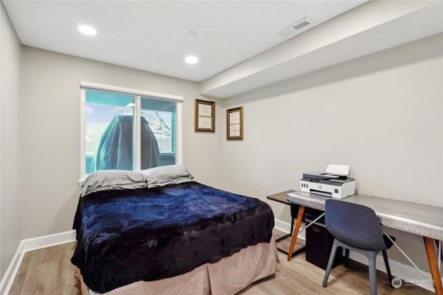 bedroom with light hardwood / wood-style floors