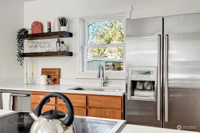 bar featuring appliances with stainless steel finishes and sink