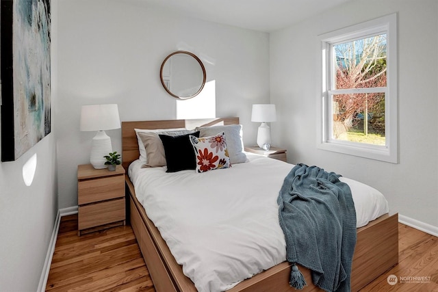 bedroom with light wood-type flooring