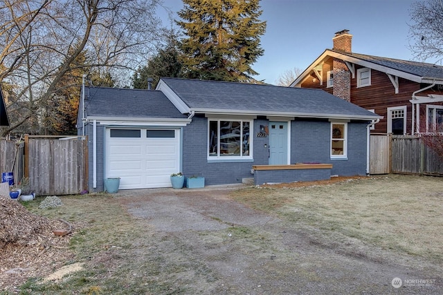 view of front facade with a garage and a front lawn