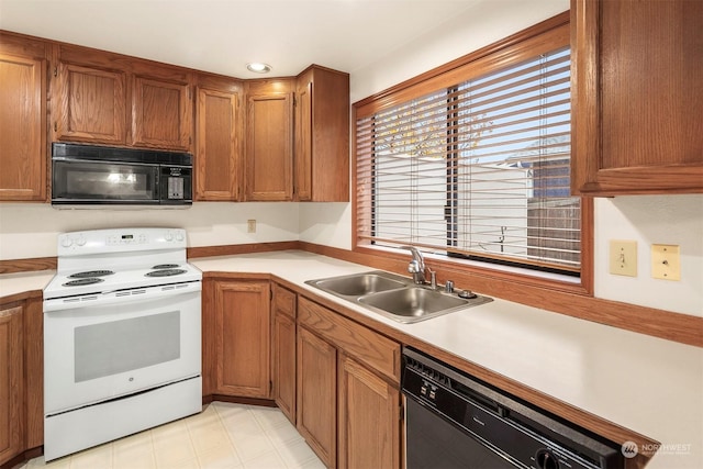 kitchen featuring sink and black appliances