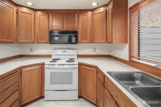 kitchen featuring sink and electric stove