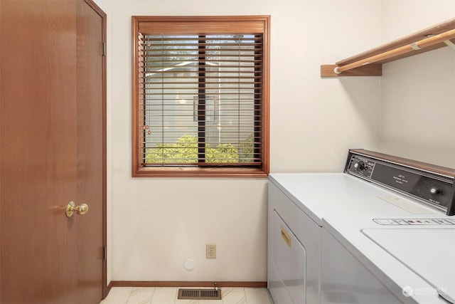 laundry area with separate washer and dryer