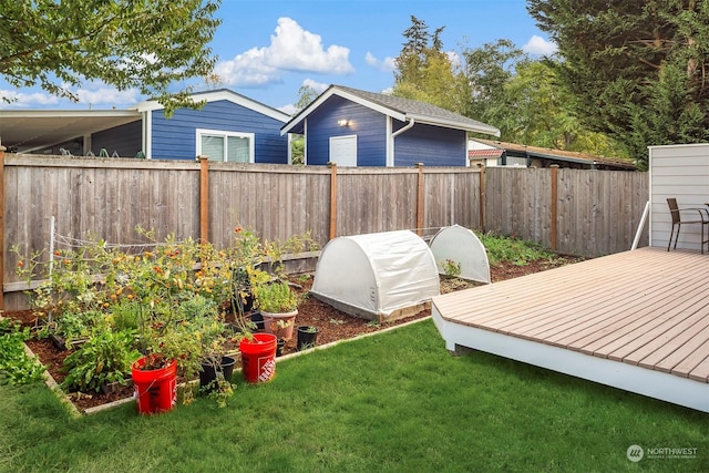 view of yard with a wooden deck