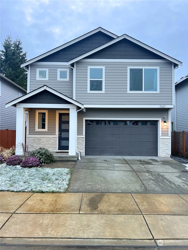 view of front of home featuring a garage and covered porch