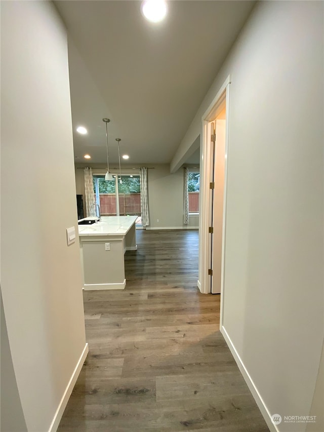 corridor featuring hardwood / wood-style flooring