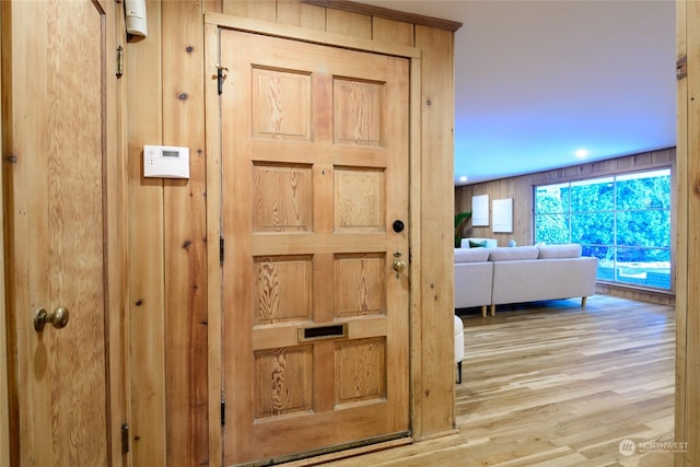 hallway with light hardwood / wood-style flooring