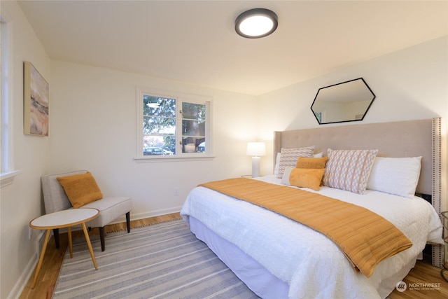 bedroom with hardwood / wood-style flooring