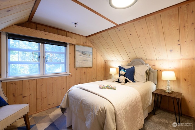 bedroom featuring lofted ceiling and wood walls