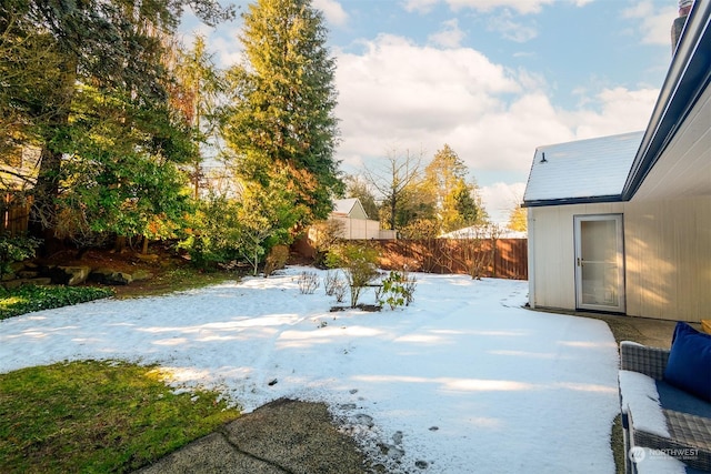 view of yard layered in snow