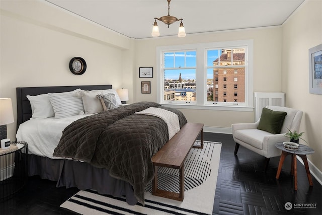 bedroom with dark parquet floors