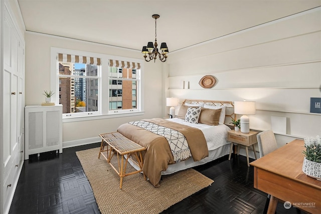 bedroom with an inviting chandelier, radiator, and dark parquet floors