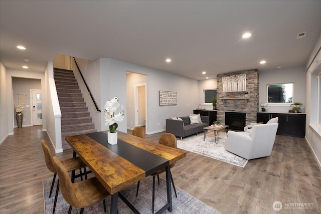 living room featuring a fireplace and light hardwood / wood-style floors