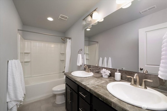 full bathroom with vanity, shower / tub combo with curtain, and toilet