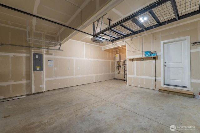 garage with a garage door opener and electric panel