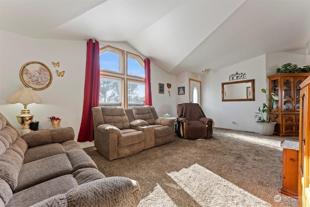 carpeted living room with lofted ceiling