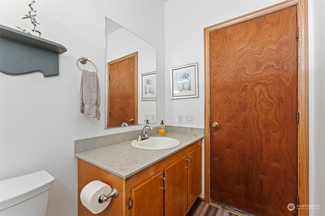 bathroom with vanity and toilet